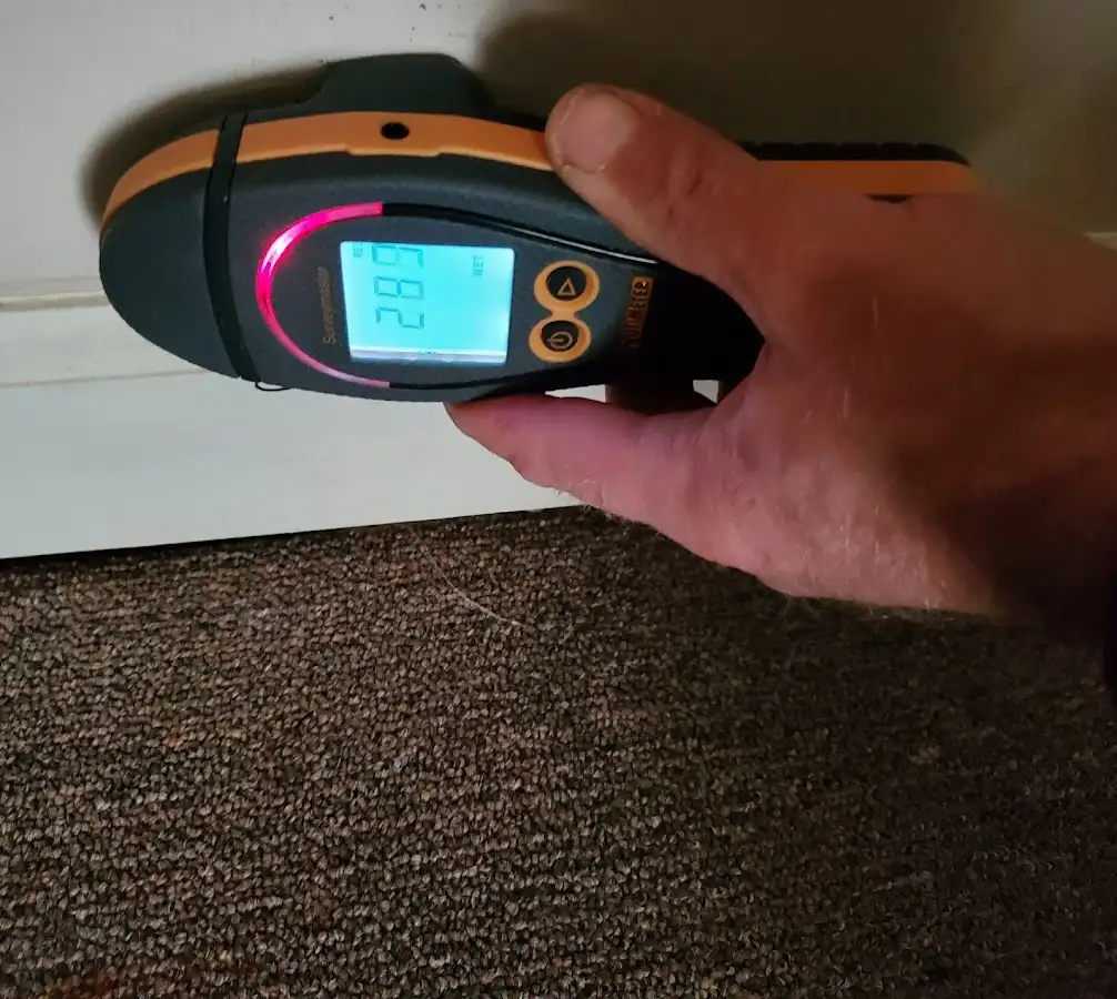 Moisture detection at baseboard during Storm Damage Restoration in Braselton